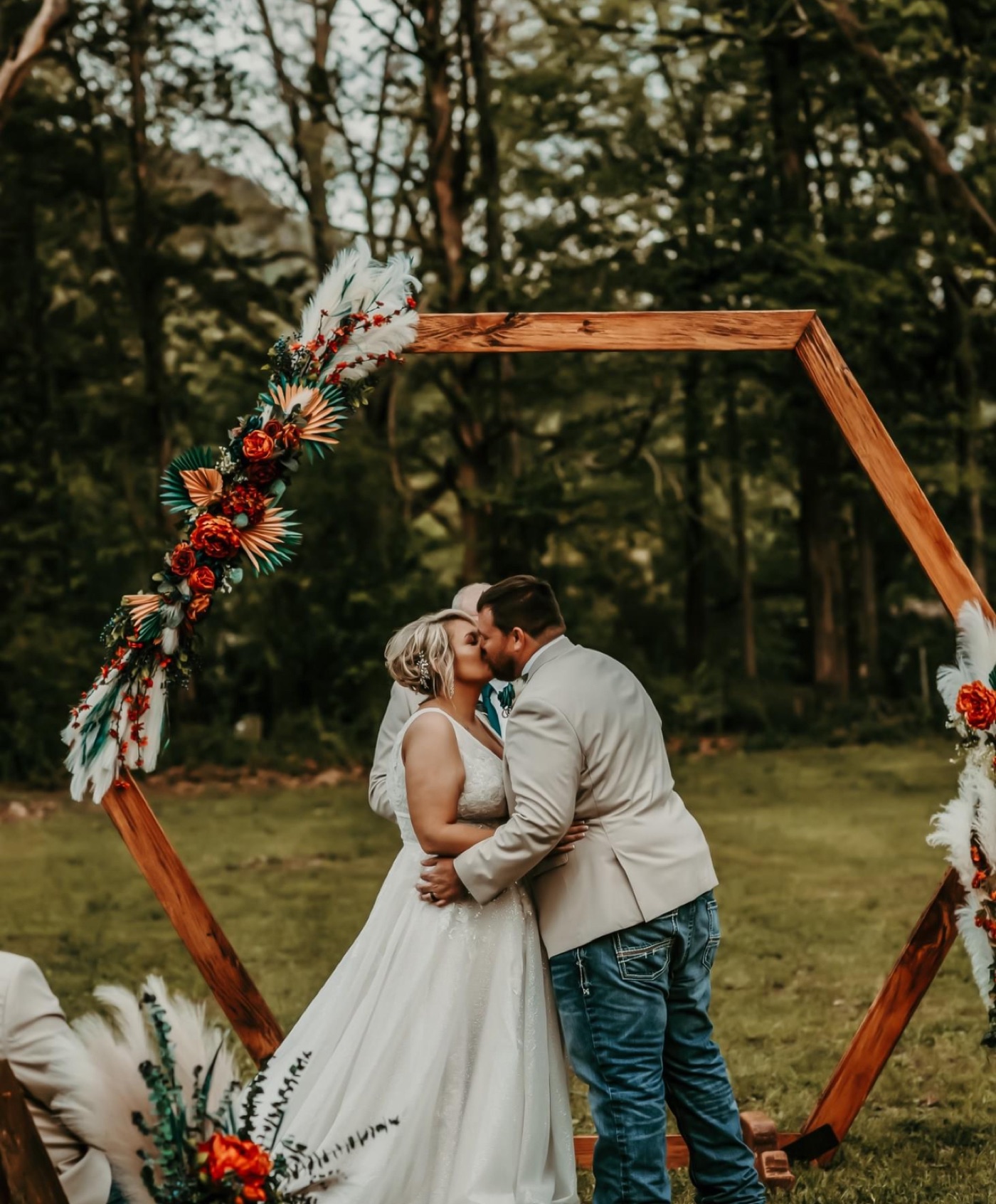 First kiss under the hexagon arch at Raulston Woods